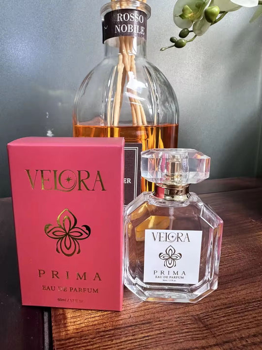 Velora Prima bottle and packaging on a wooden surface