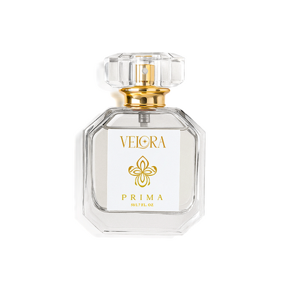 Velora Prima luxury eau de parfum bottle with clear glass design, gold accents, and floral logo on white label.